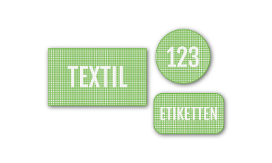 Zwei neongelbe Visitenkarten mit auffälligen schwarzen Grafikelementen und Social-Media-Symbolen sind schräg übereinander gestapelt und zeigen den Text „einszweidrei“ in der unteren linken Ecke.