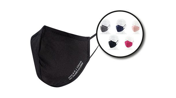 Im Vordergrund ist eine schwarze FFP2-Nanomaske zu sehen, daneben ein kreisförmiger Ausschnitt, der fünf weitere Maskenfarben – Schwarz, Marineblau, Beige, Grau und Rosa – auf Schaufensterpuppenköpfen zeigt.